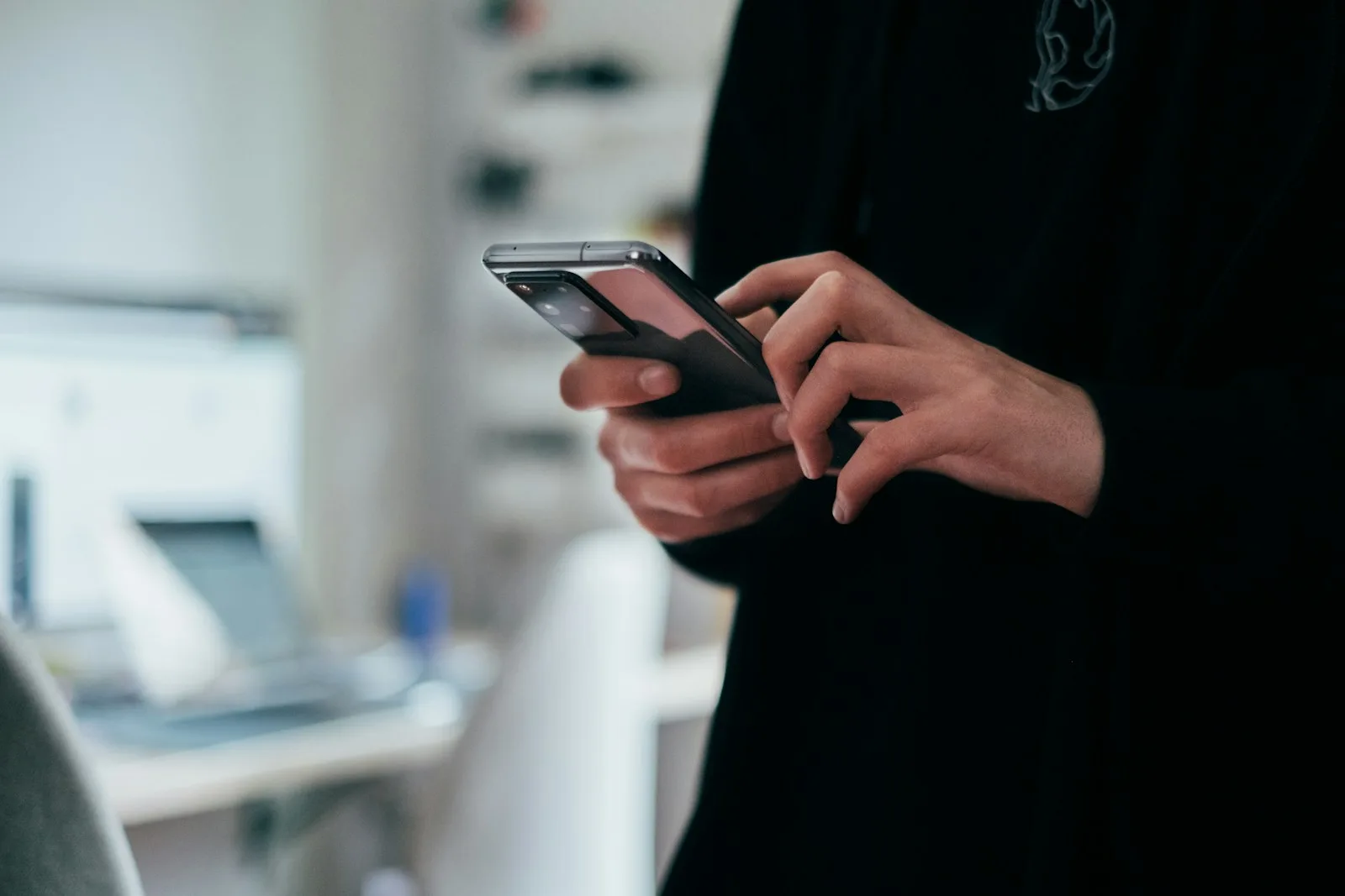Person using a smartphone – chatbot and online safety