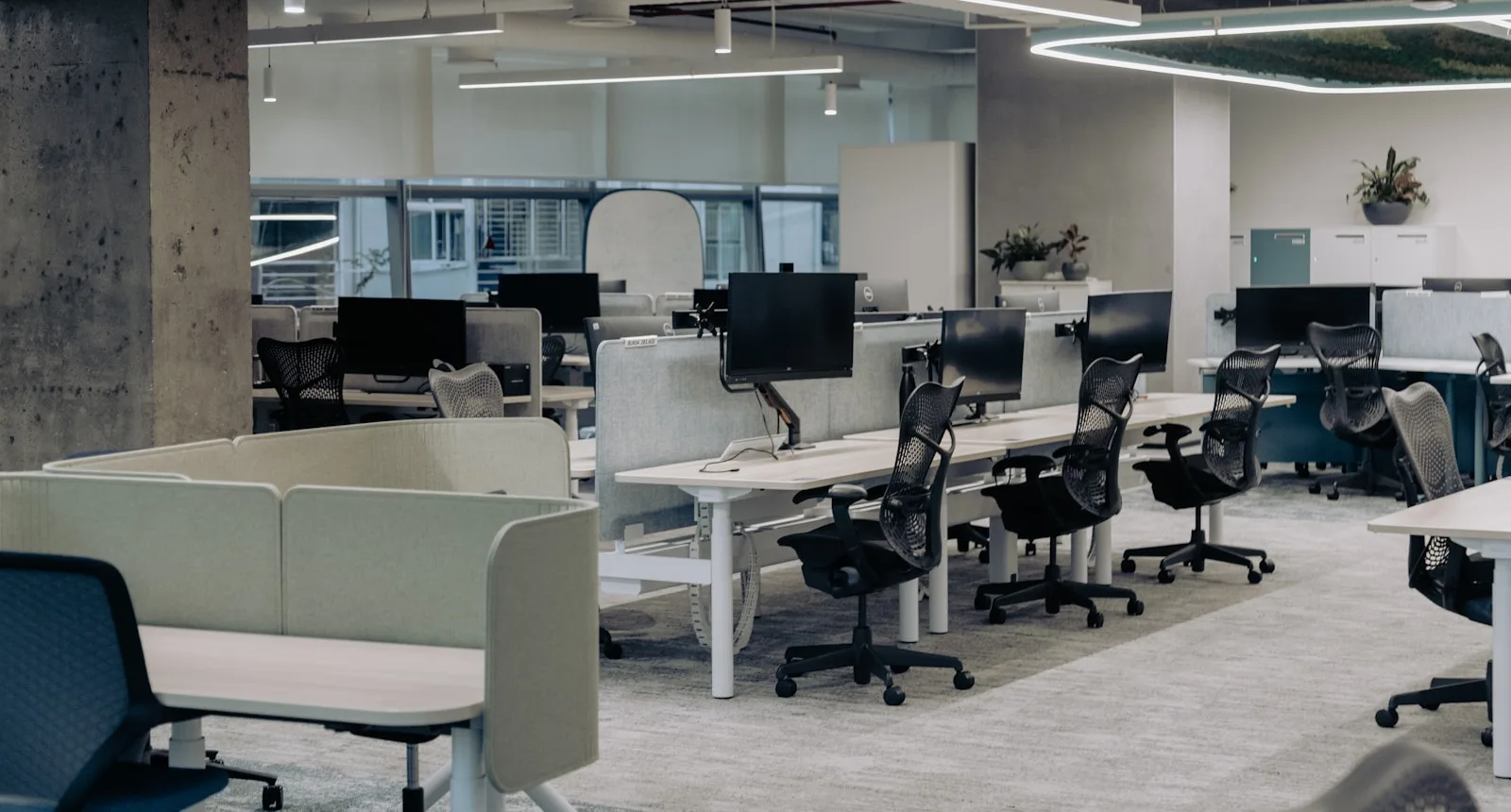 Empty open-plan office with vacant desks – AI and employment