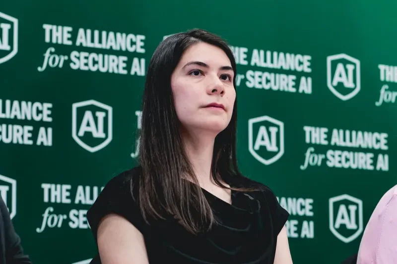 Vael Gates, founder of Humans in Control, seated on a conference panel in front of an Alliance for Secure AI backdrop.